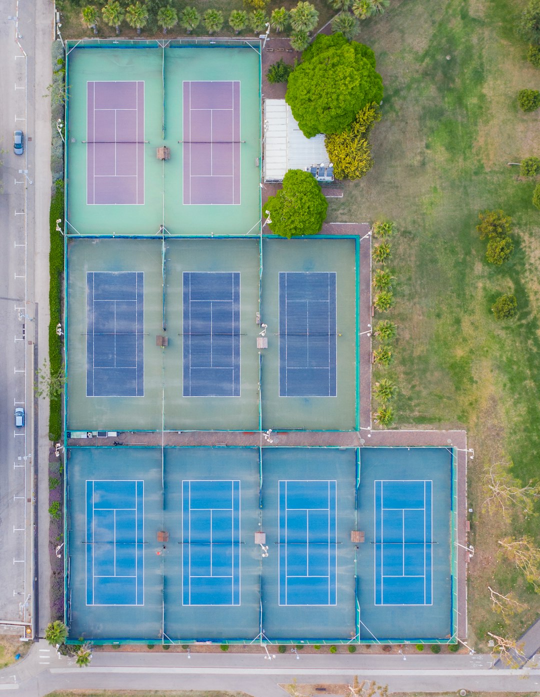 aerial view of green trees and blue steel gate