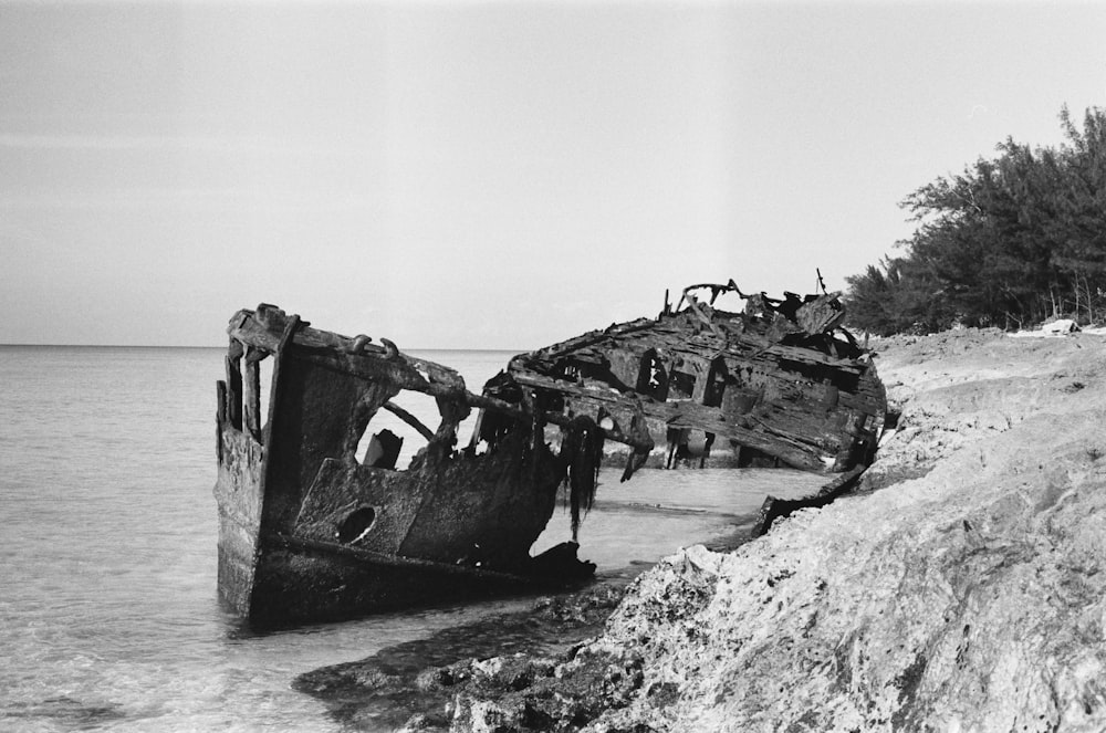 grayscale photo of wrecked ship