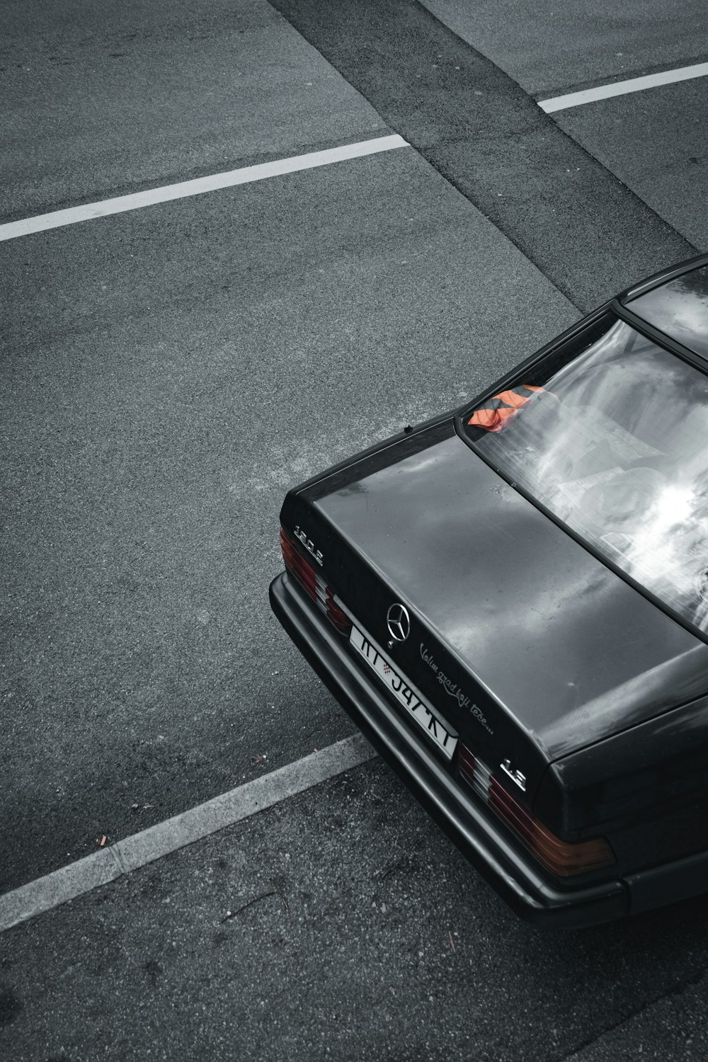 black car on gray asphalt road