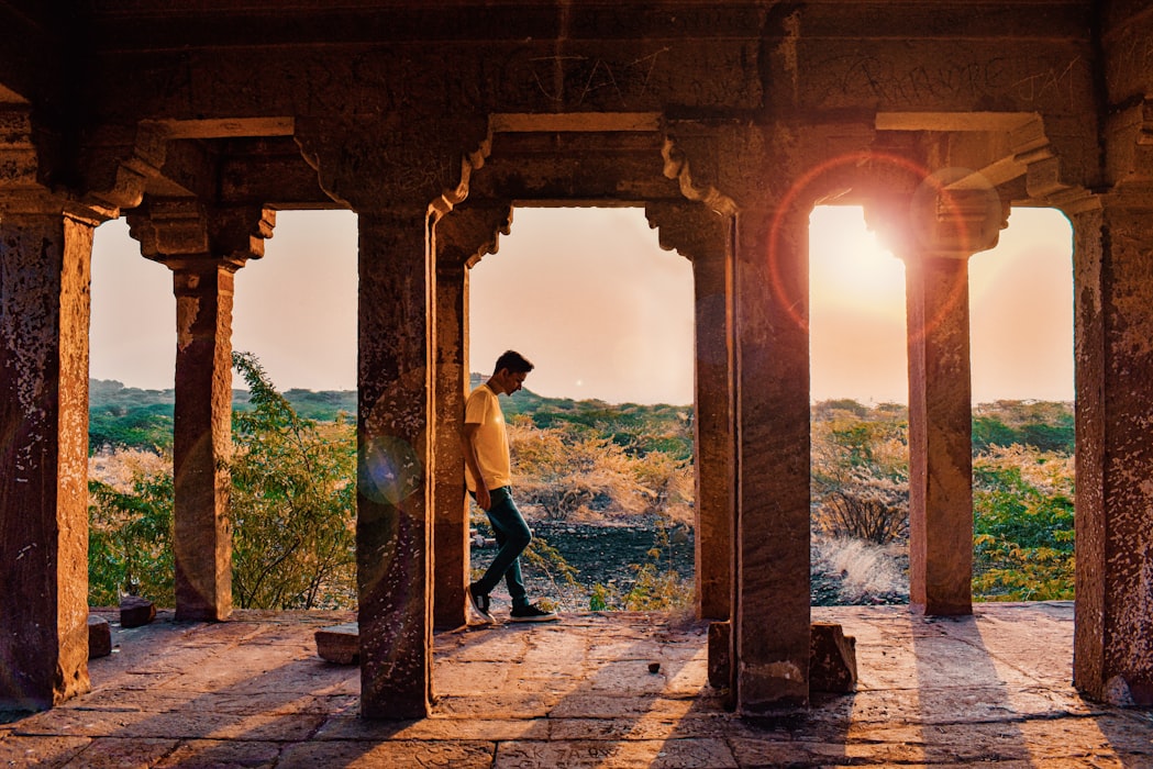 A guy standing in a temple 