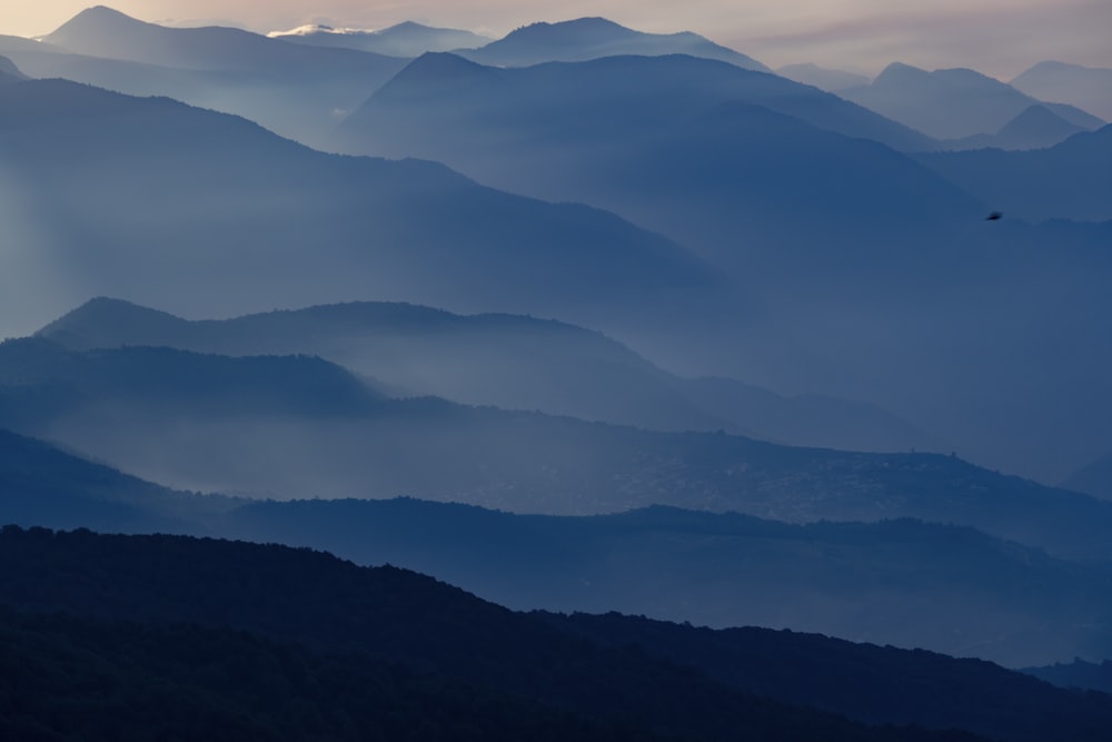 mountains under white clouds during daytime