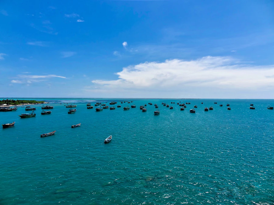 Pilgrims performing a ritual bath in the sea, symbolic of purification at the sacred theerthams