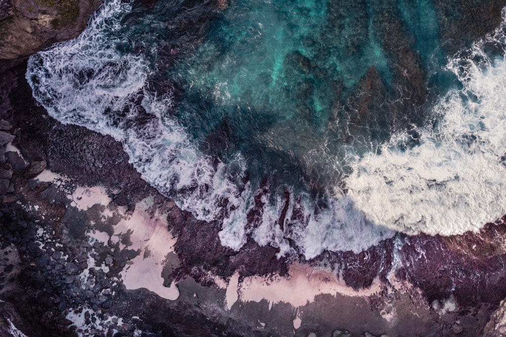 white and blue ocean waves