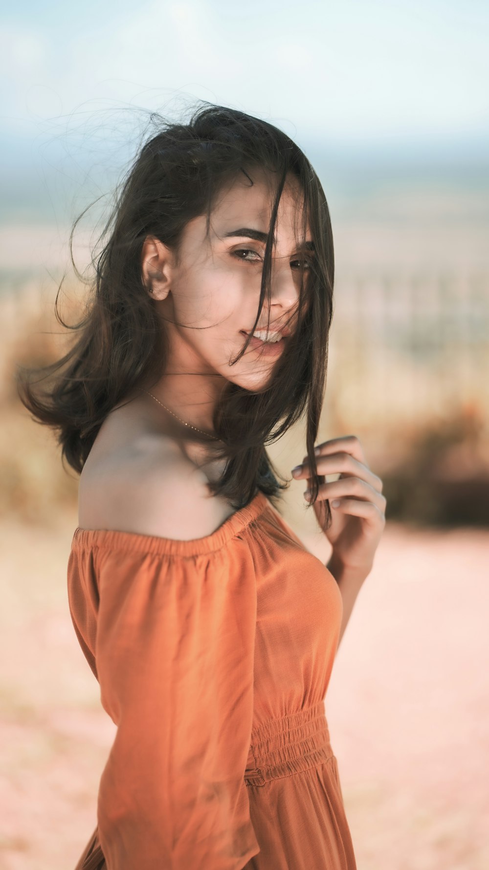 woman in red spaghetti strap top