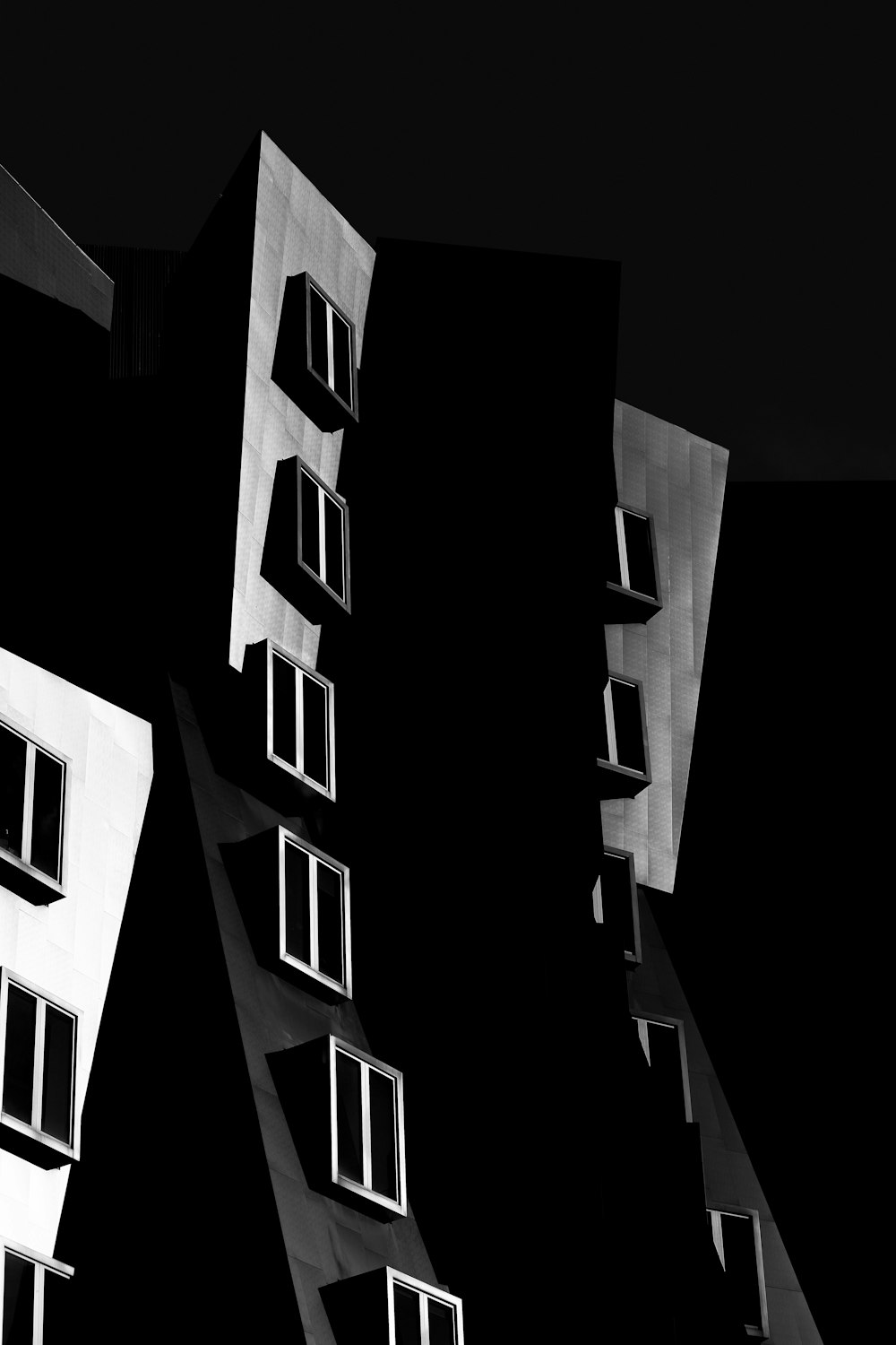 grayscale photo of high rise building