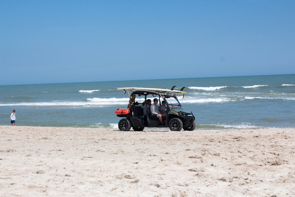 black jeep wrangler on beach during daytime