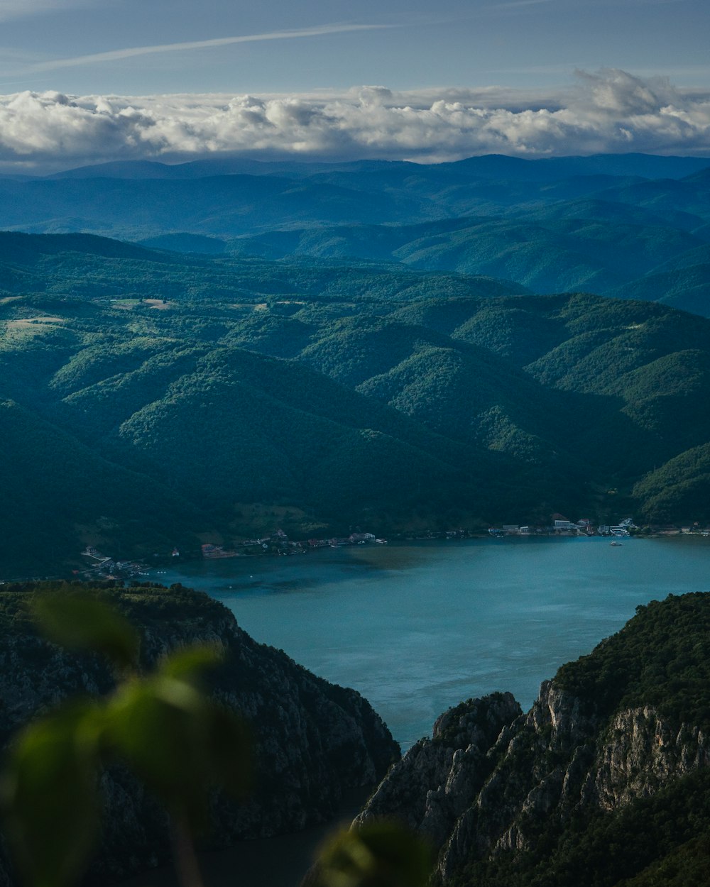 green mountains near body of water during daytime