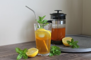 clear drinking glass with orange juice