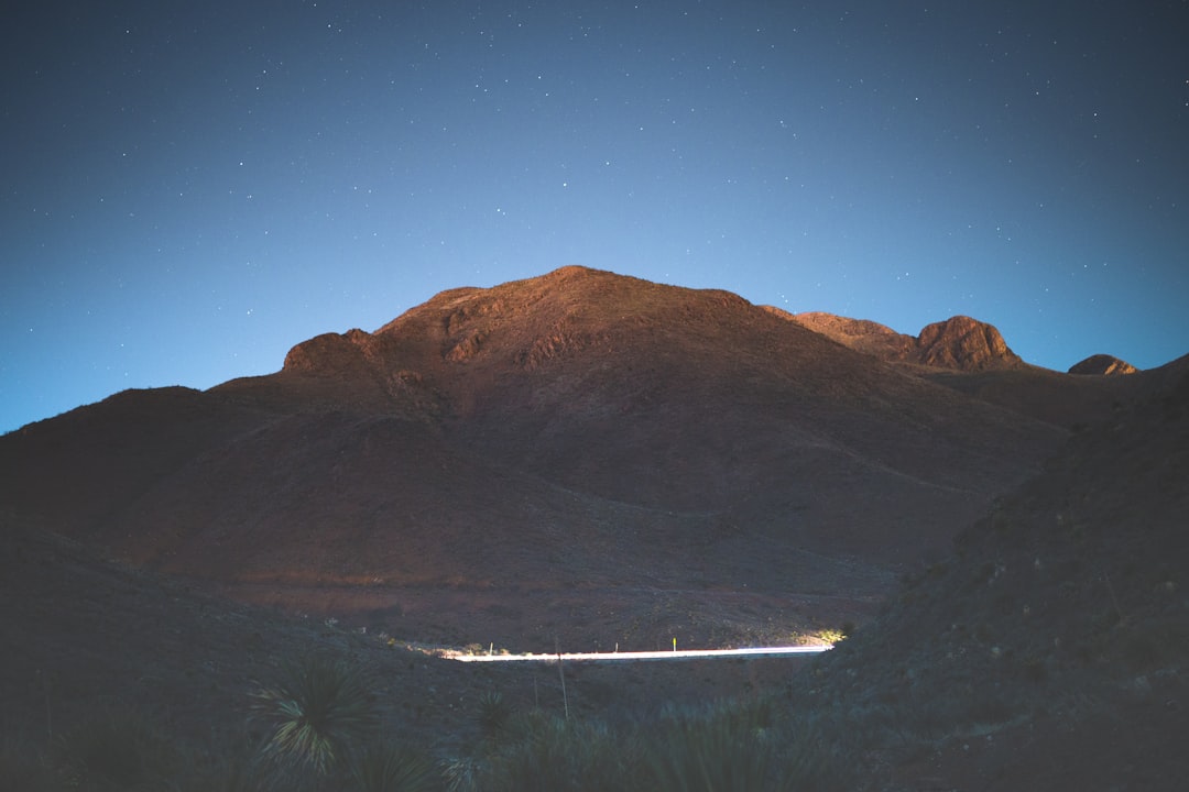 brown mountain under blue sky during night time