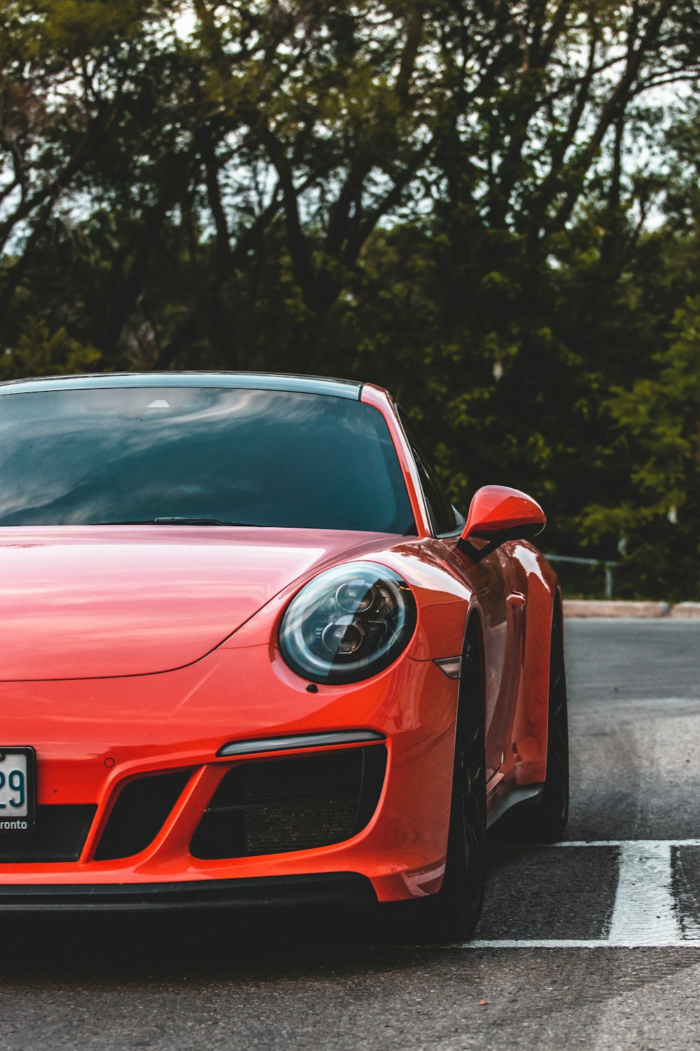 red ferrari 458 italia on road during daytime