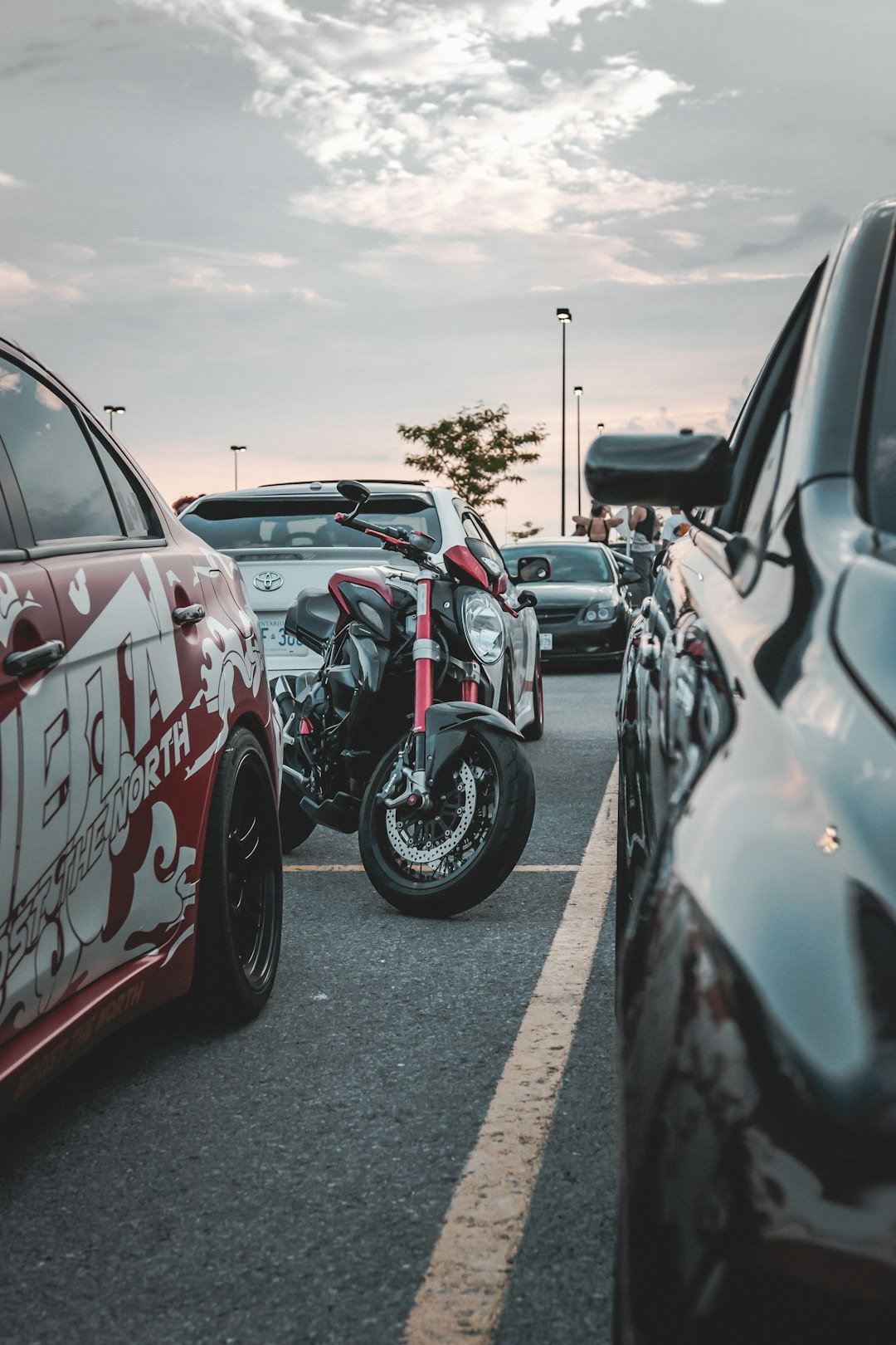 cars parked on parking lot during daytime