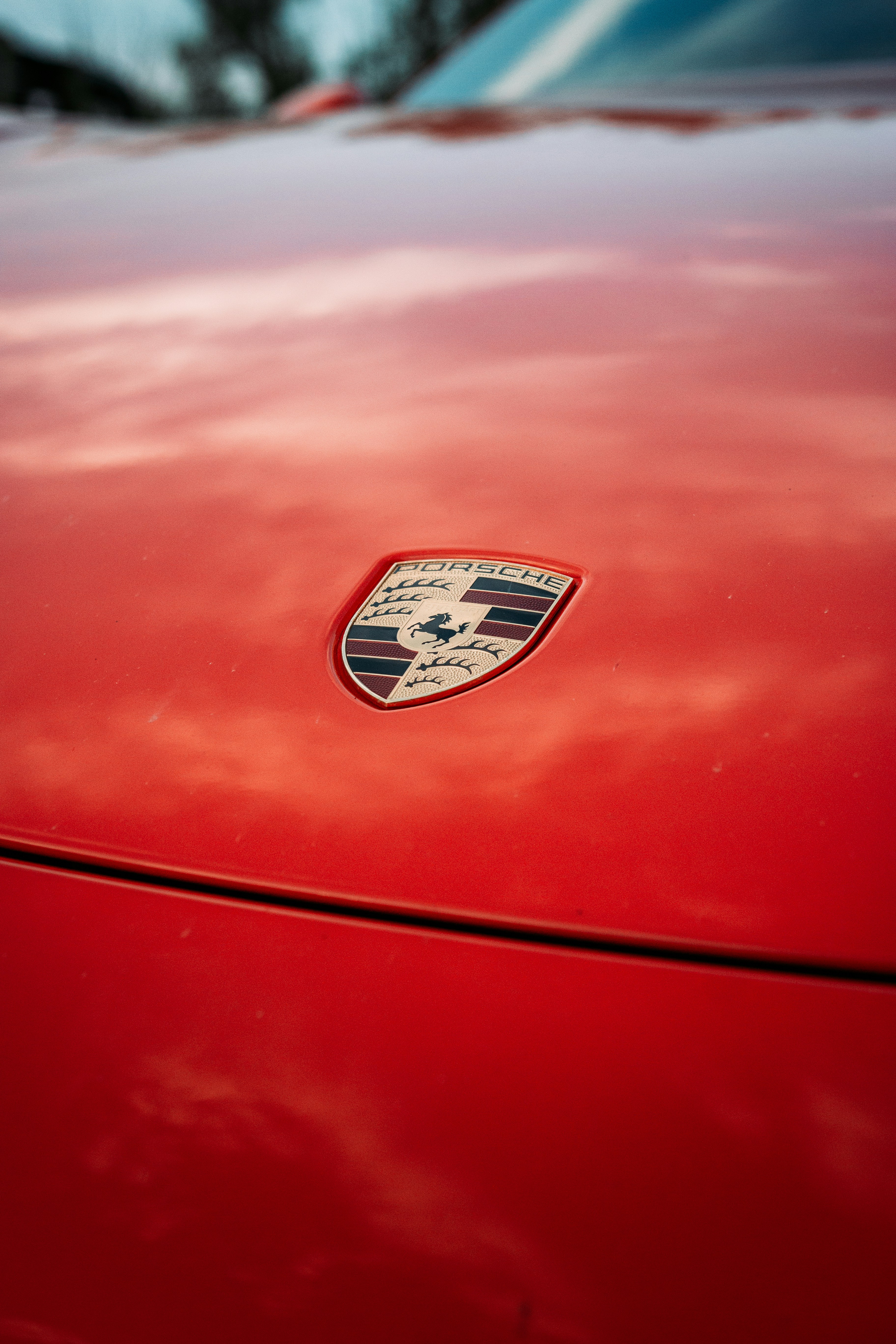 red Porsche badge