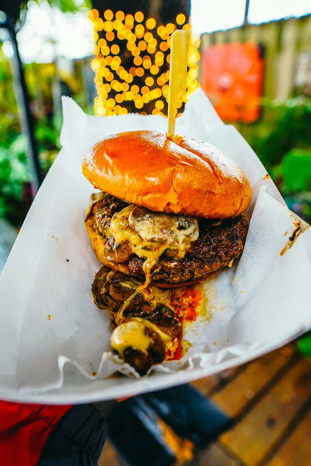 burger on white paper plate