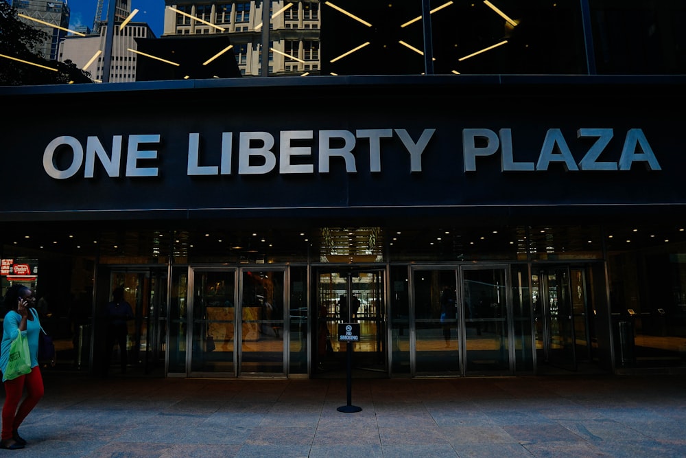 a woman is standing outside of a building