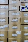 brown cardboard boxes on brown wooden table