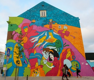 A vibrant mural painted on a city wall, featuring whimsical characters and bold colors.