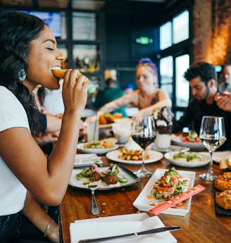 woman in white shirt eating