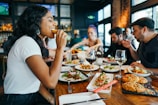 A group of friends enjoying a meal at a local restaurant.