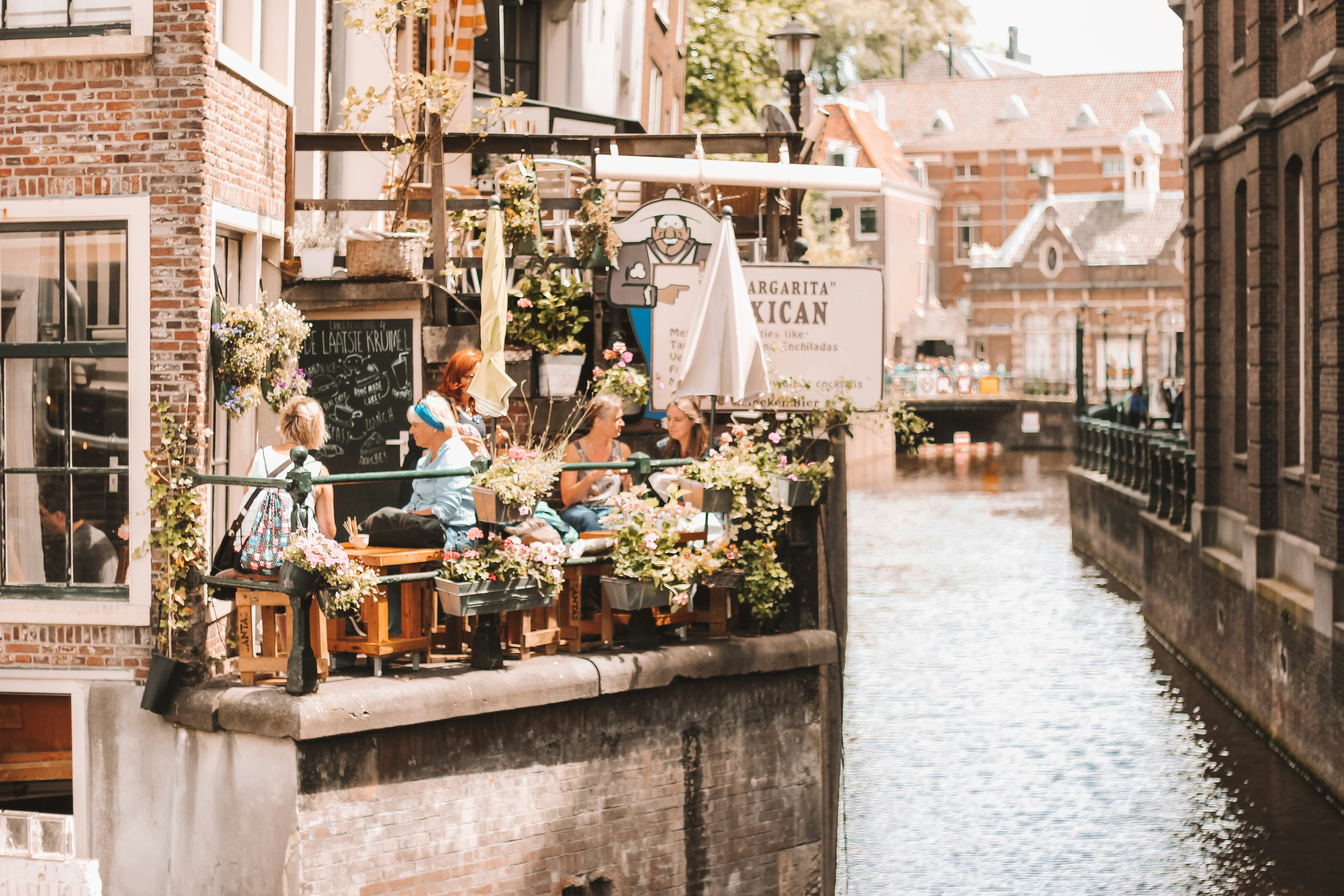 people in a restaurant near a river