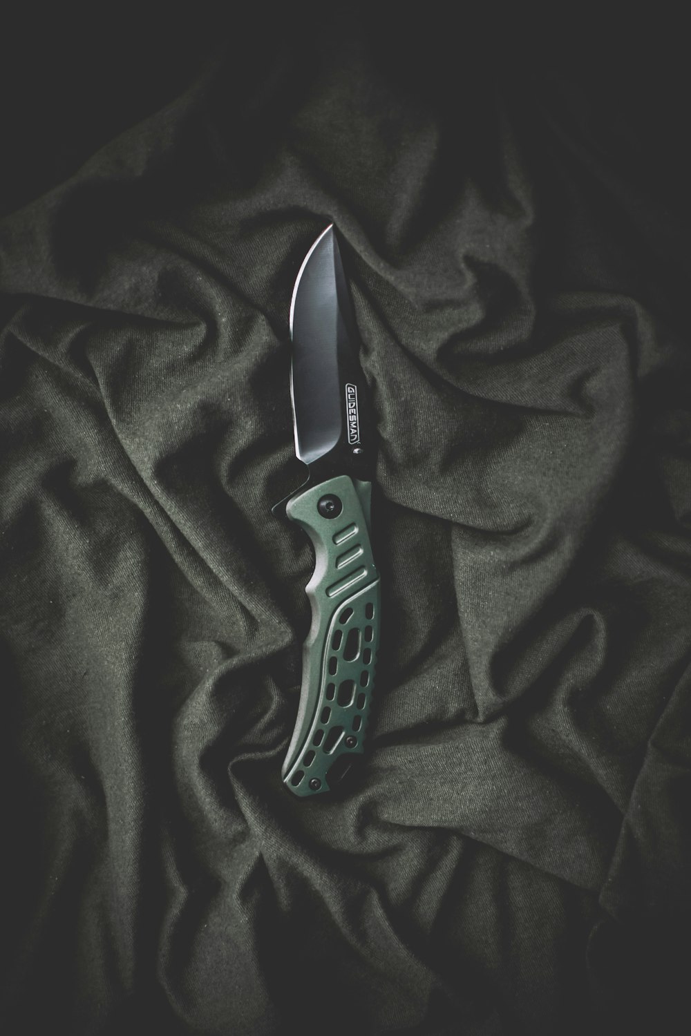 black and silver folding knife