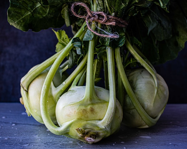 Green vegetable on blue wooden table