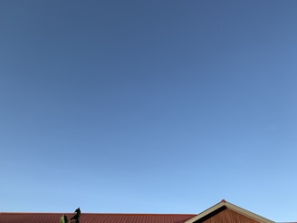 A clean, minimalist weather app displaying sunny skies and temperature details.