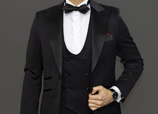 man in black suit jacket and black dress pants