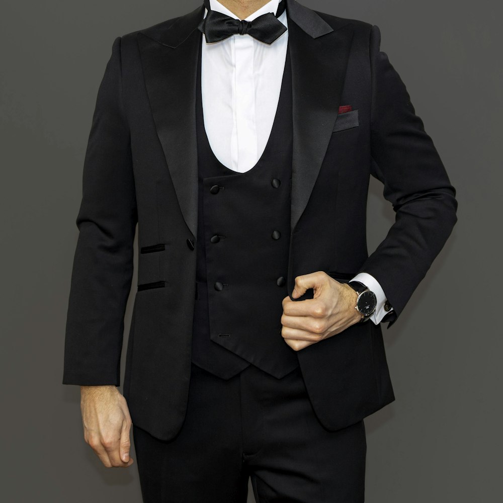 man in black suit jacket and black dress pants