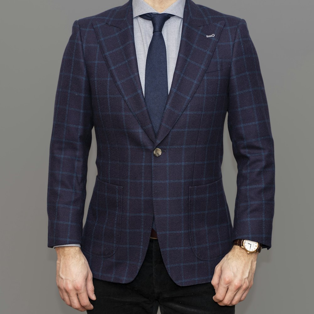 man in blue suit jacket