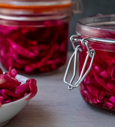 red liquid in clear glass jar