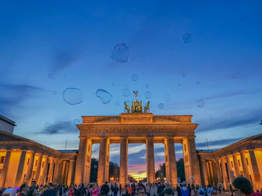 people walking on street near building during daytime in Pariser Platz Germany