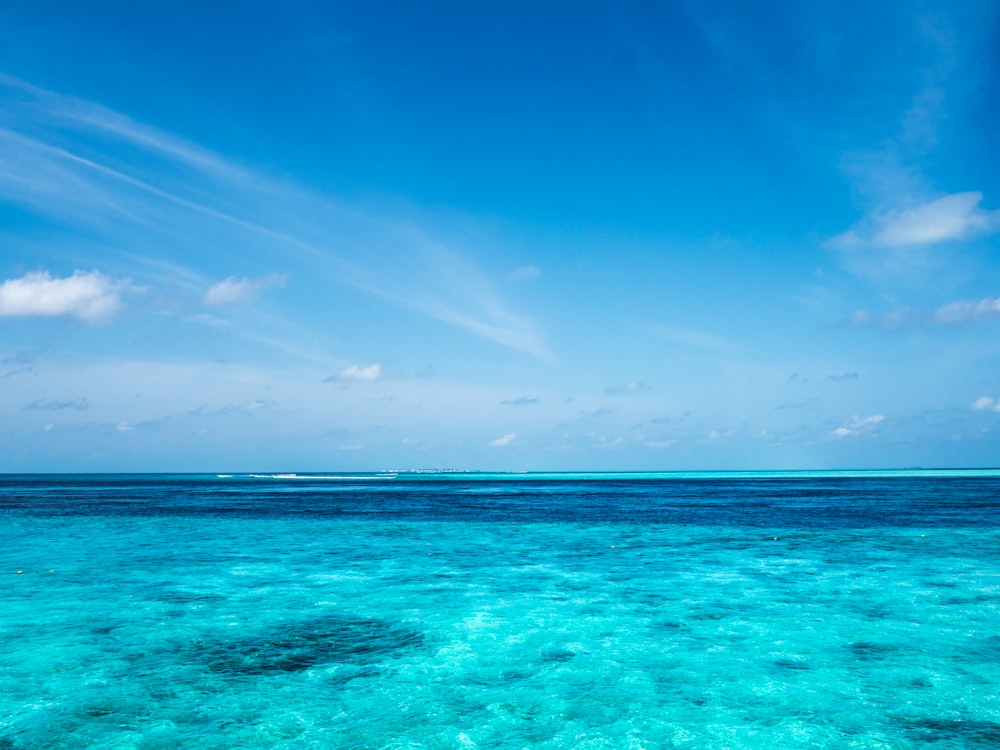 blue sea under blue sky during daytime