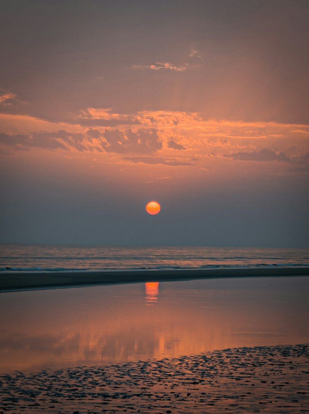 body of water during sunset