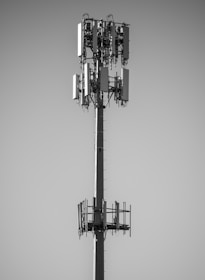 grayscale photo of black and white electric tower