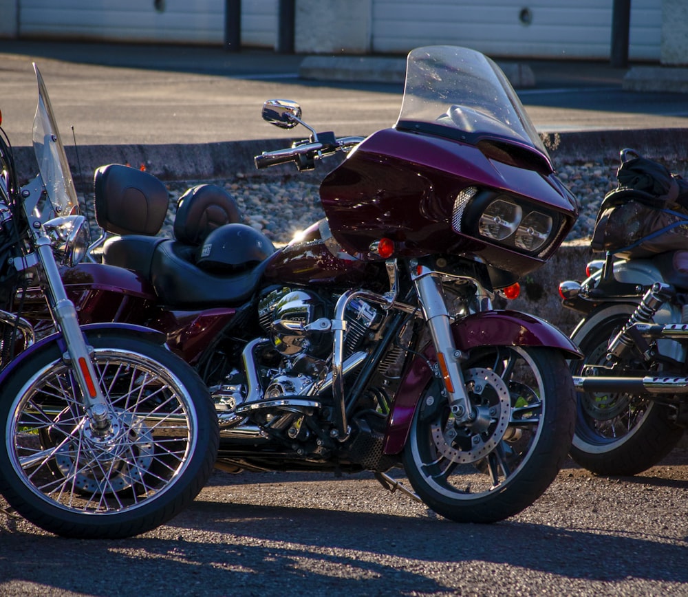 red and white sports bike parked on gray concrete road during daytime