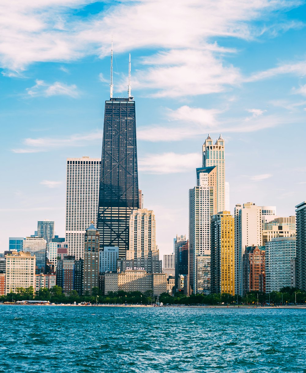 high rise buildings near body of water during daytime