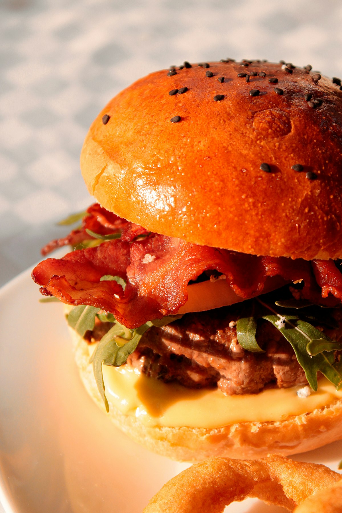 A burger with lettuce and tomato representing fast food industry earnings and the value meal revival