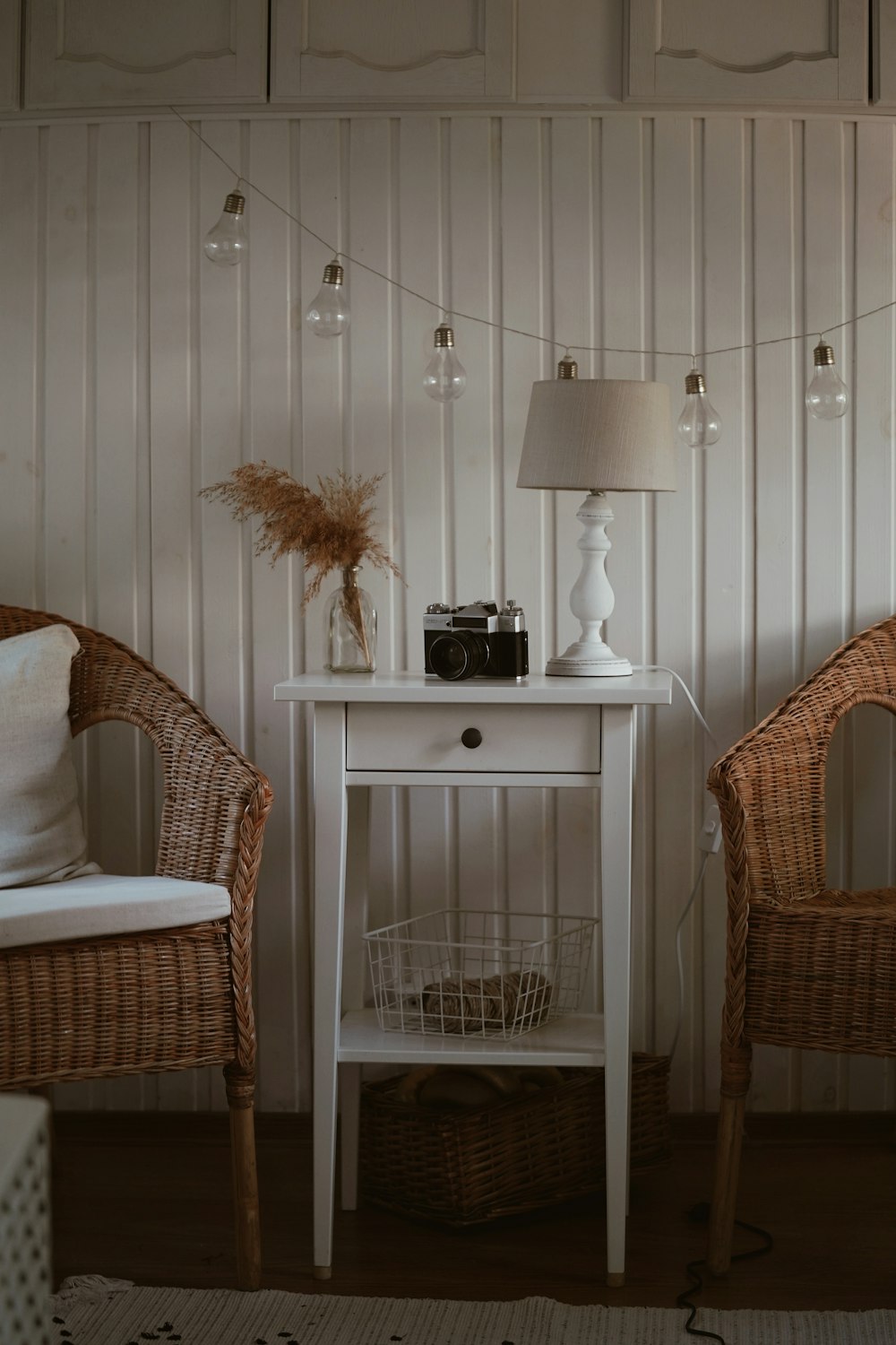 black and white table lamp on white wooden nightstand