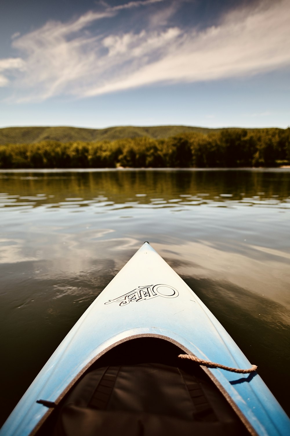 white and black kayak on lake during daytime