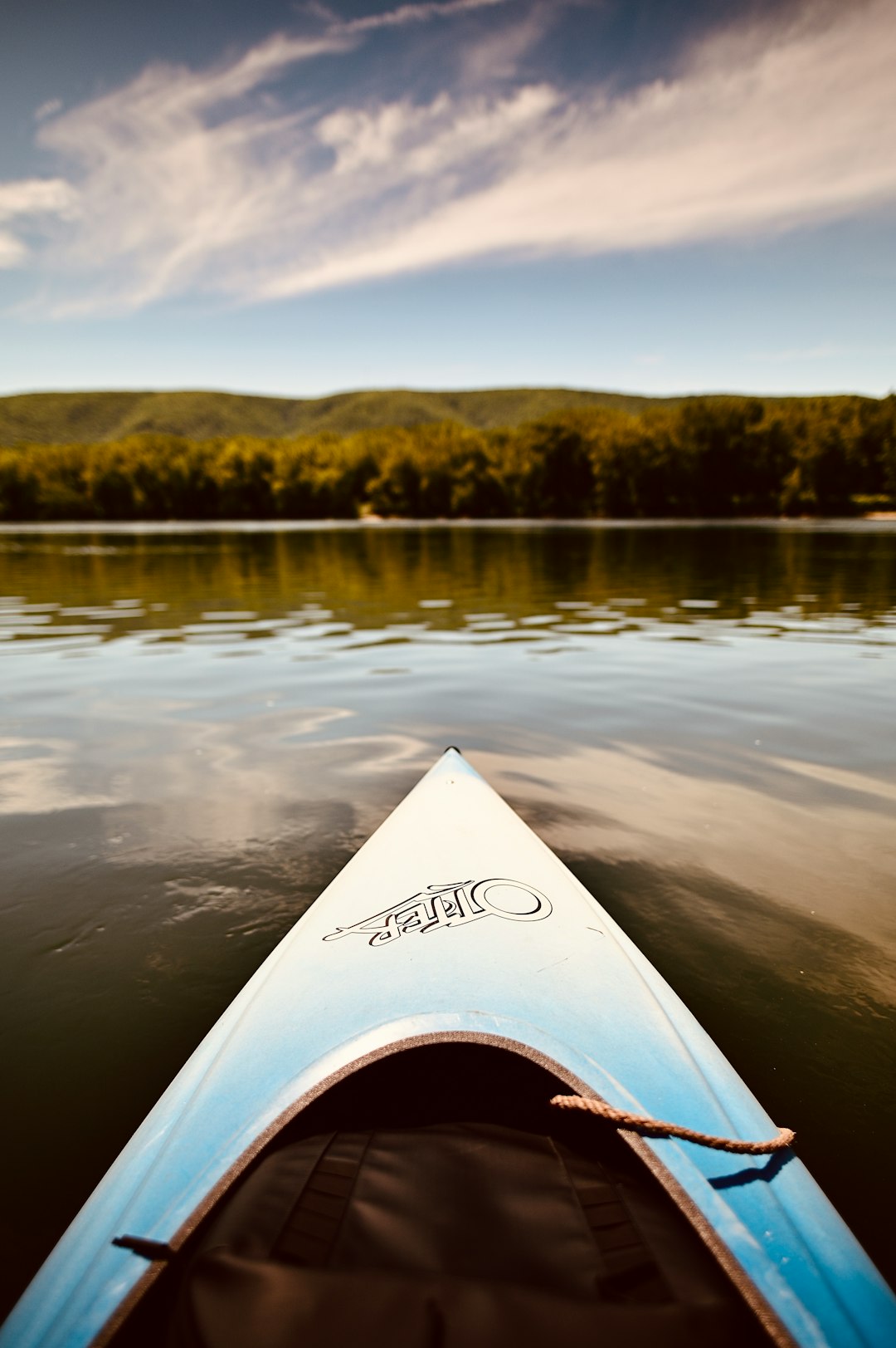 white and black kayak on lake during daytime