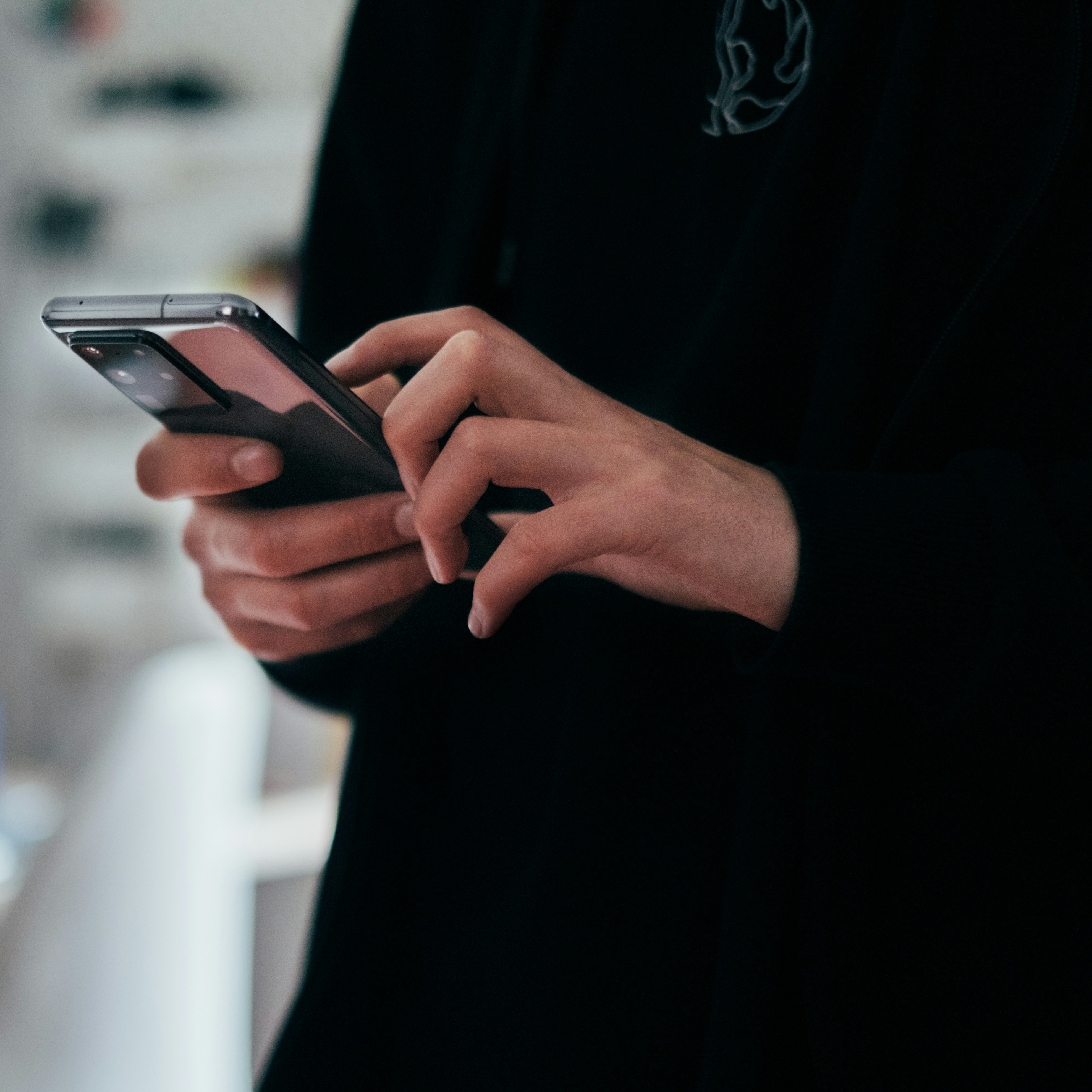 person holding black android smartphone