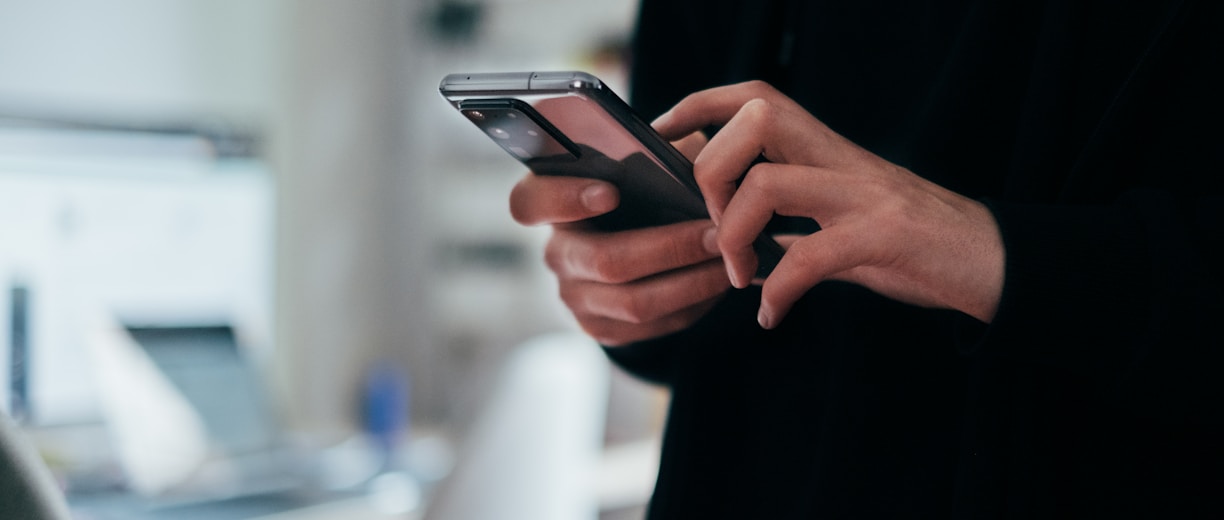 person holding black android smartphone