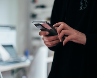 person holding black android smartphone