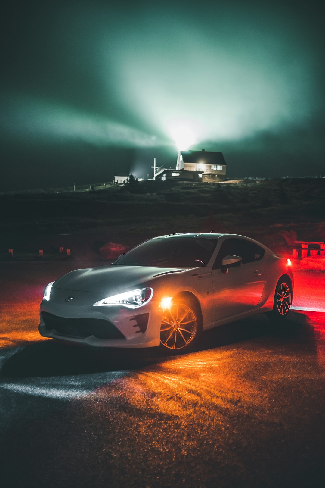 white porsche 911 on road during night time