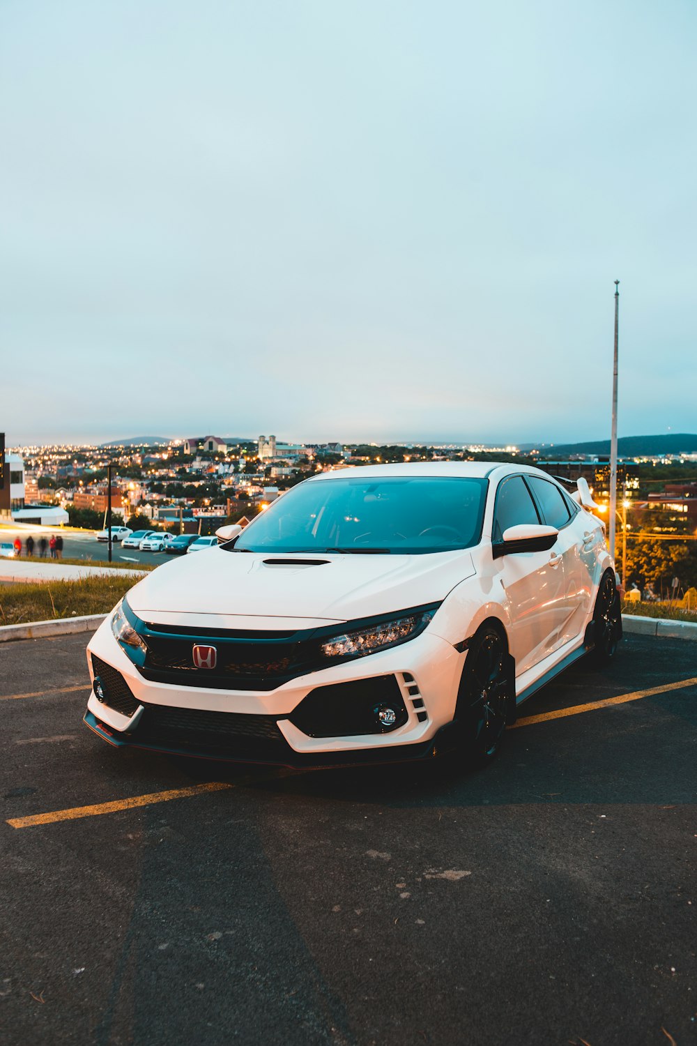 white honda sedan on road during daytime