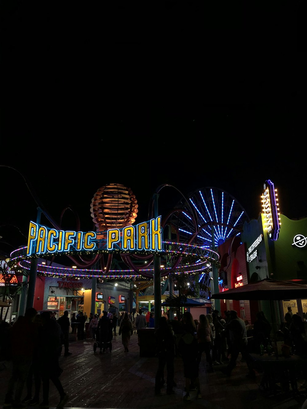 people walking on street during nighttime