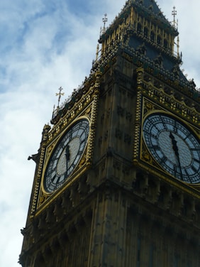 A close-up shot of the colorful clock face of Pachuca's monumental clock under a bright blue sky.