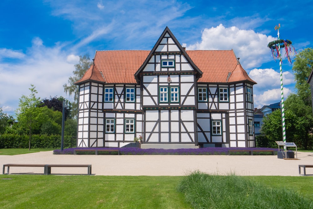 white and brown concrete house under blue sky during daytime