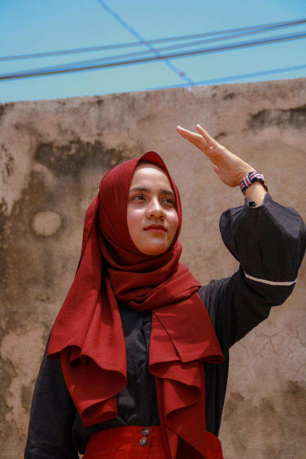 woman in red hijab and black long sleeve shirt