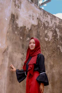 A summer outfit combining a breezy maxi skirt, a sleeveless top with a matching hijab, perfect for warm days.